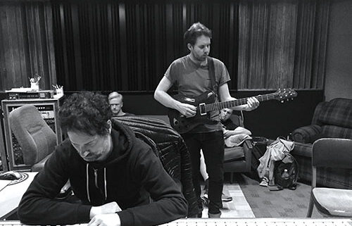 Musicians working in a recording studio.